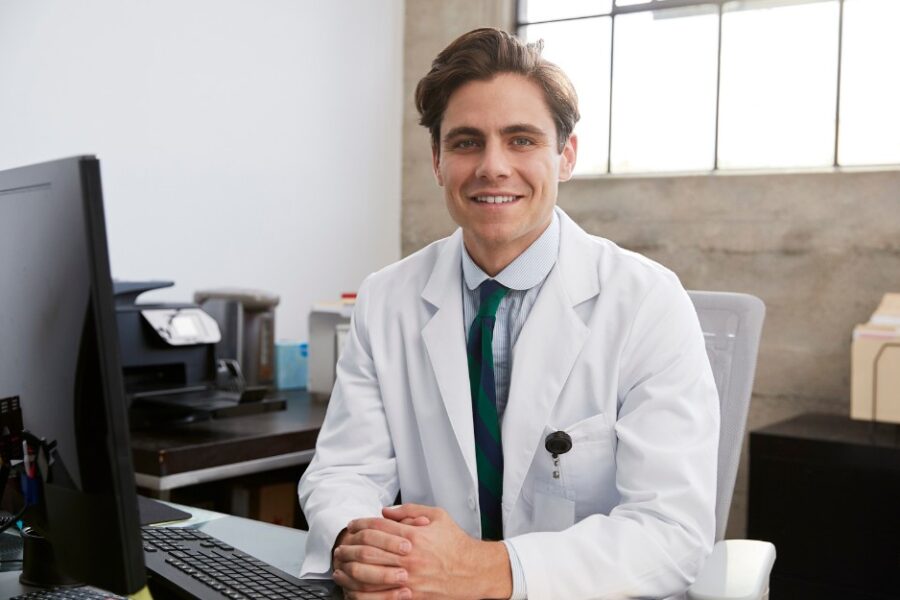 Smiling young male doctor who knows about home loans for medical professionals