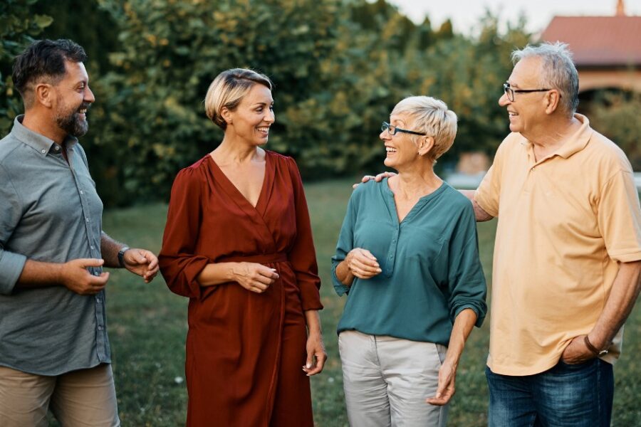 Happy couple talking to parents/family about a guarantor home loan
