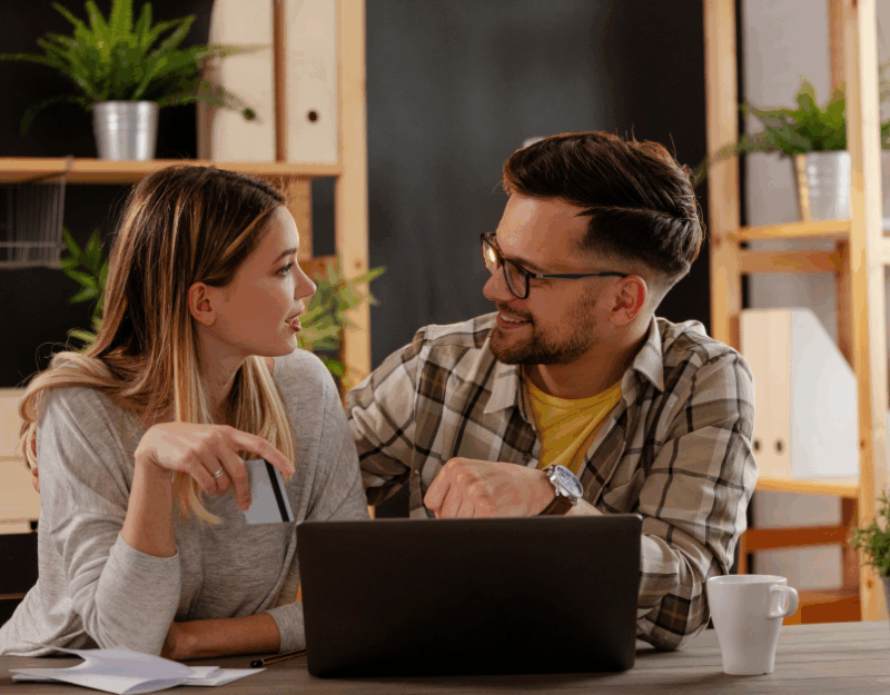 Couple talking while researching about home loans and loan-to-value ratio.