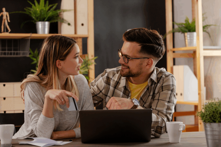 Couple talking while researching about home loans and loan-to-value ratio.