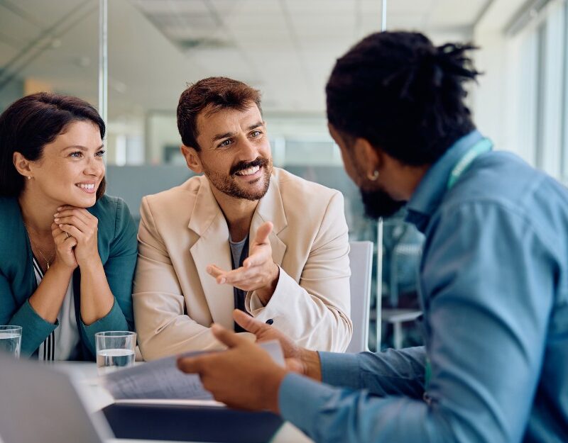 Couple talking to a mortgage broker about a home loan and their borrowing capacity