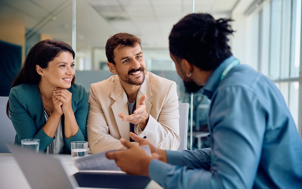 Couple talking to a mortgage broker about a home loan and their borrowing capacity